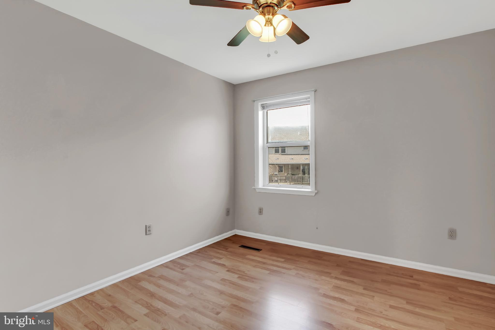 24 Winding Way Lititz, PA 17543 - Photo 17 of 27 a view of an empty room with wooden floor and a window