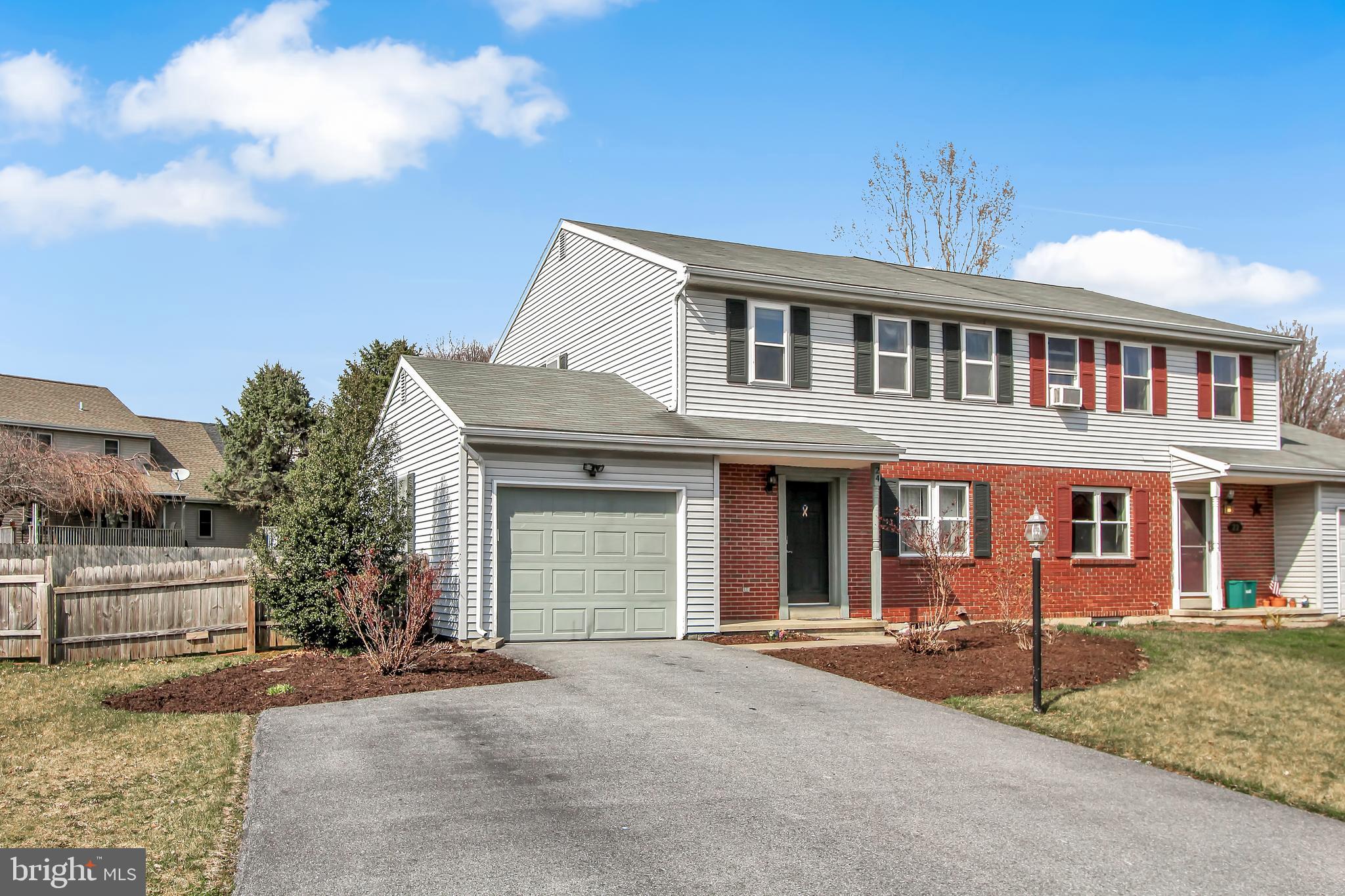 24 Winding Way Lititz, PA 17543 - Photo 26 of 27 a front view of a house with a garden