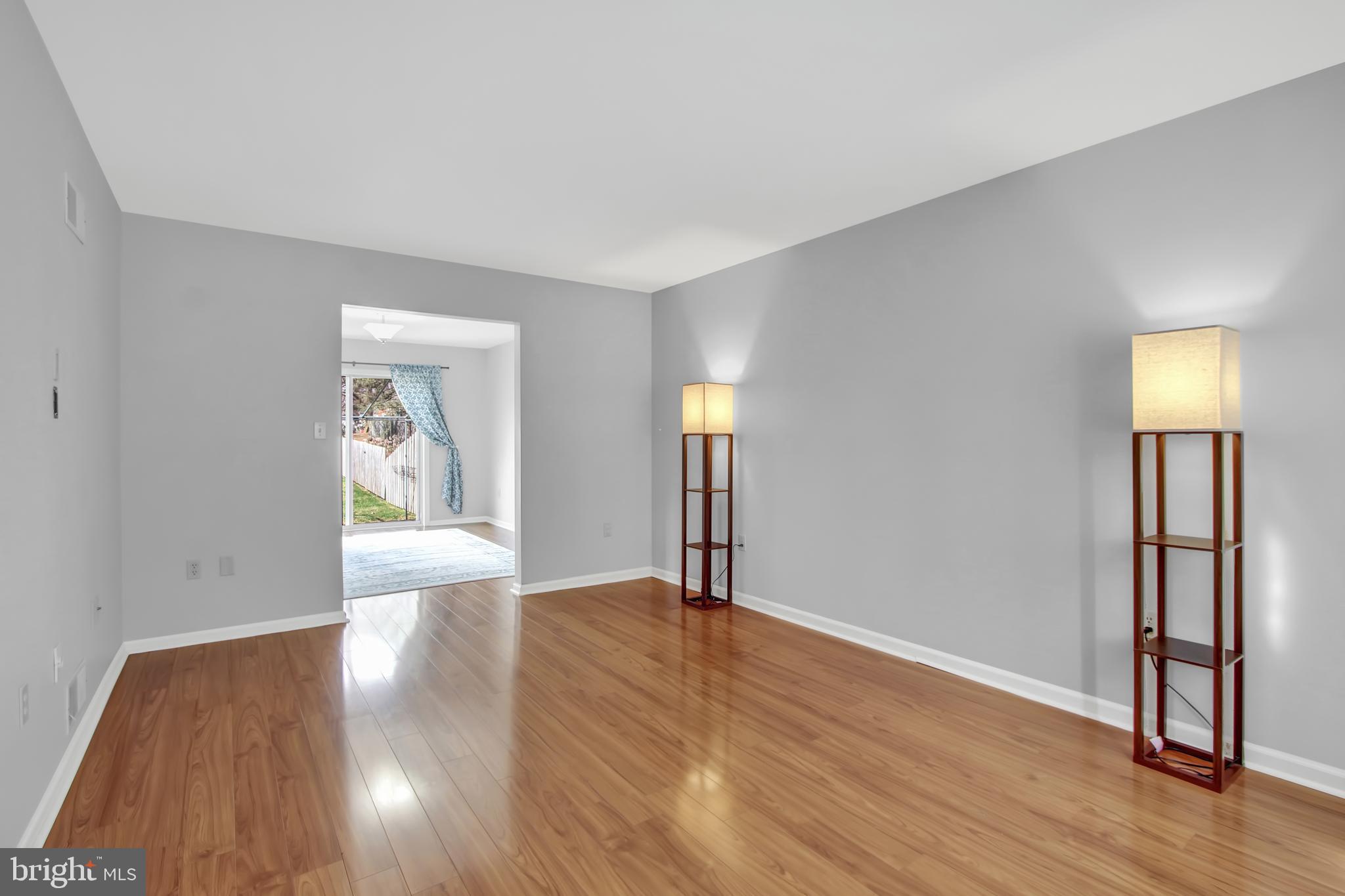 24 Winding Way Lititz, PA 17543 - Photo 4 of 27 a view of an empty room with wooden floor and a window