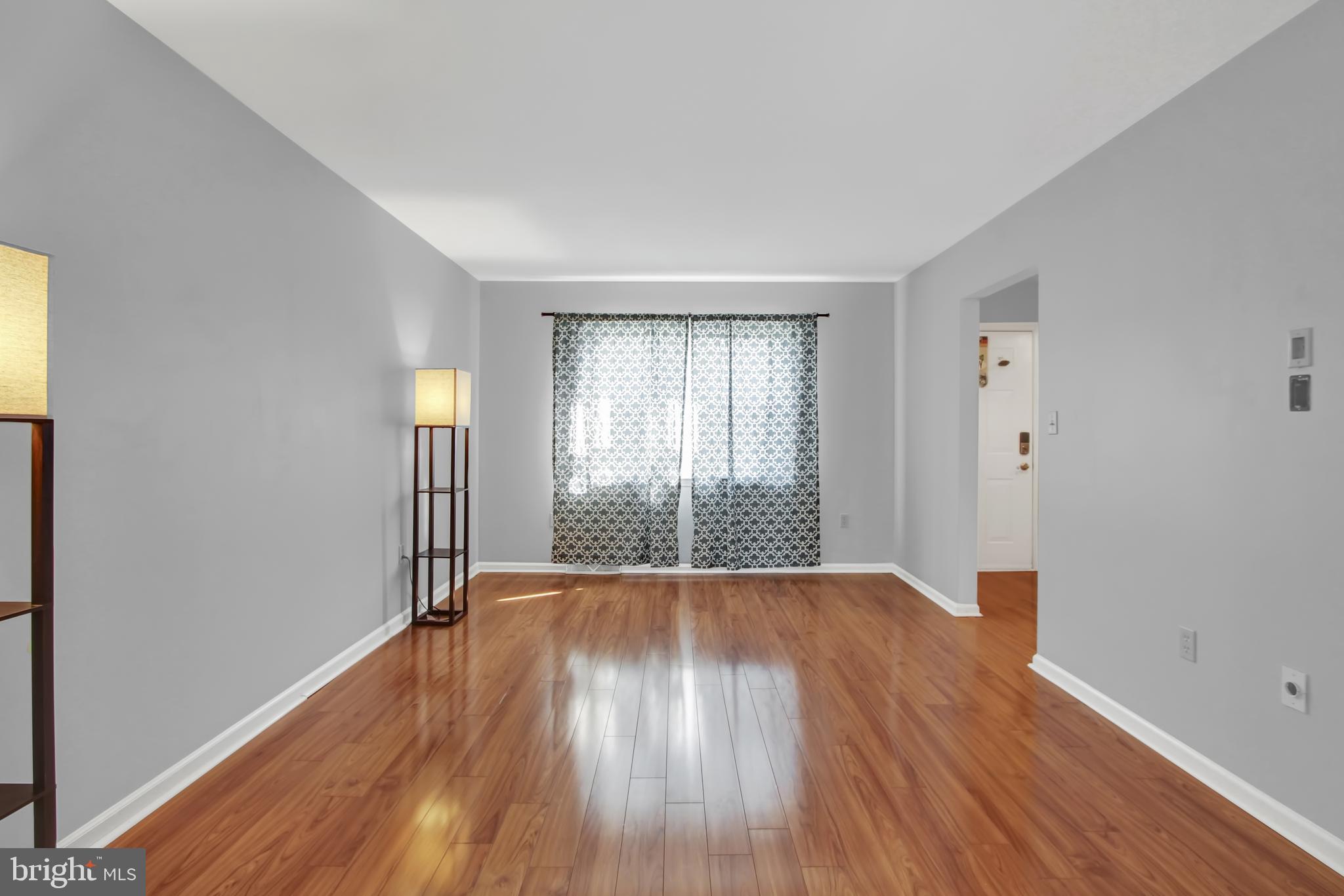 24 Winding Way Lititz, PA 17543 - Photo 6 of 27 a view of an empty room with wooden floor and a window