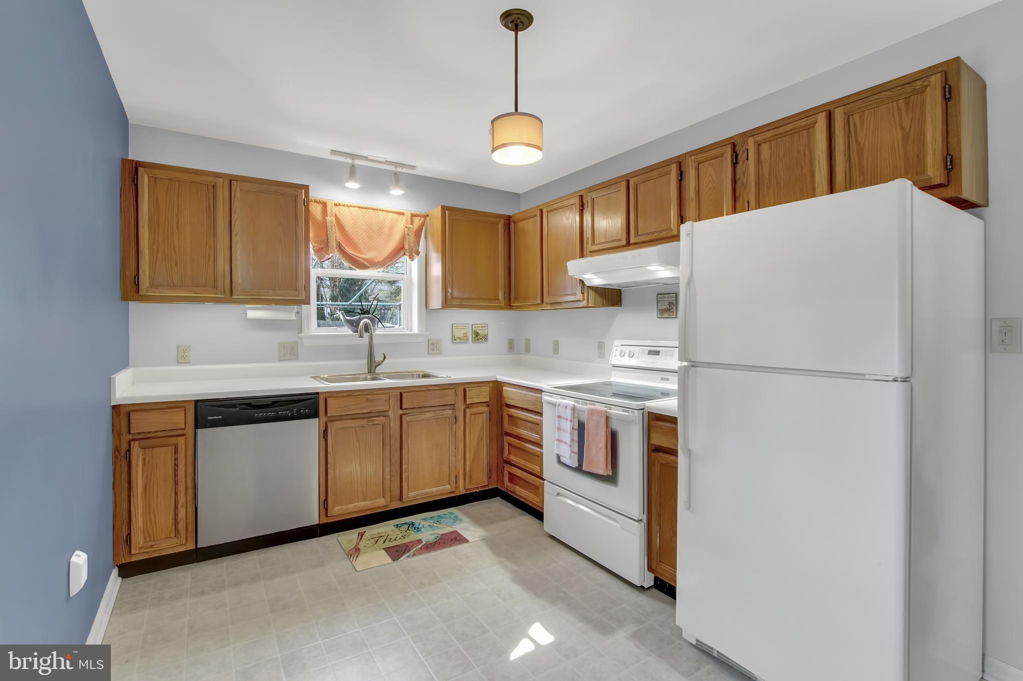 24 Winding Way Lititz, PA 17543 - Photo 9 of 27 a kitchen with refrigerator cabinets and a sink