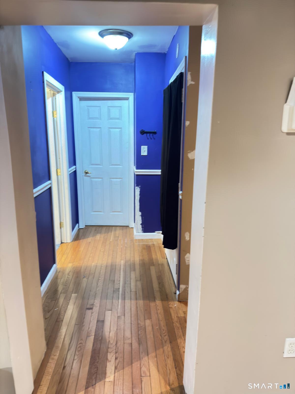 32 Winter Street Ansonia, CT 06401 - Photo 4 of 14 a view of a hallway with wooden floor