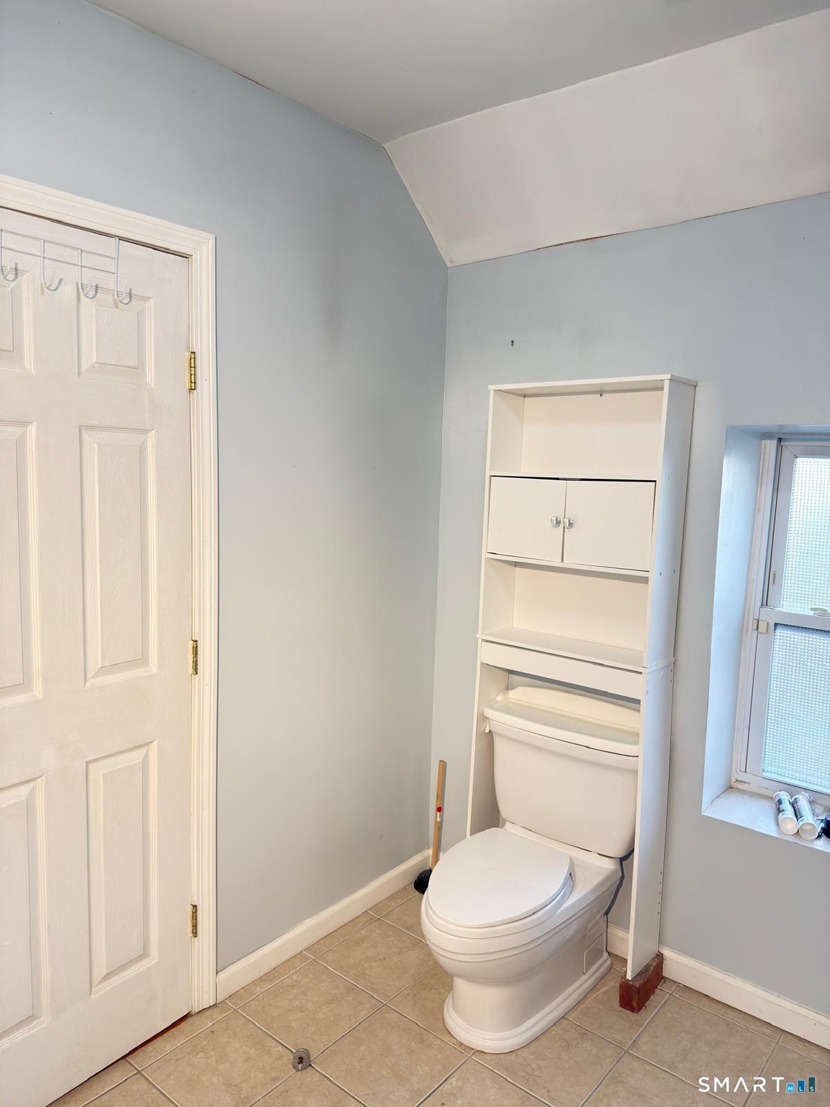 32 Winter Street Ansonia, CT 06401 - Photo 8 of 14 a white toilet sitting next to a bathroom