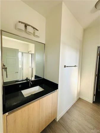 a bathroom with a sink and a mirror