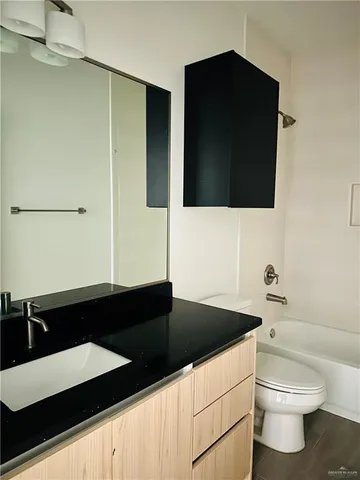 a bathroom with a sink and a toilet