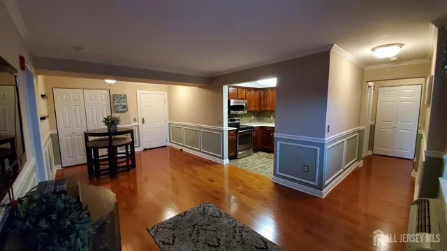 a view of kitchen with furniture and wooden floor