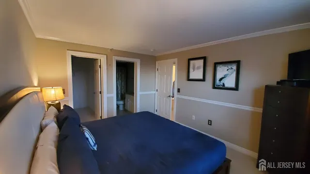 a bed room with a bed and a television