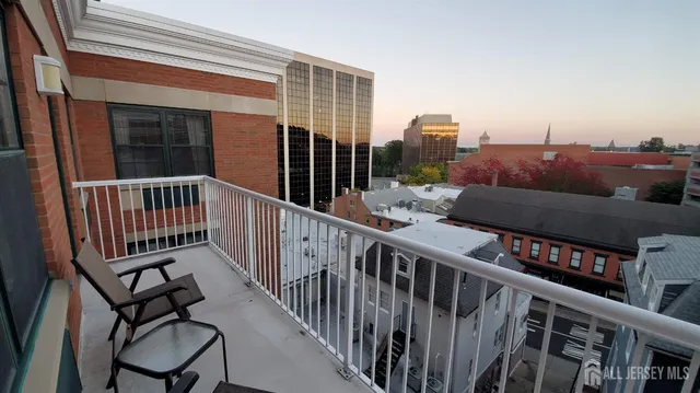 a view of a balcony with furniture