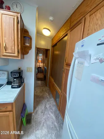 a hallway with washer and dryer