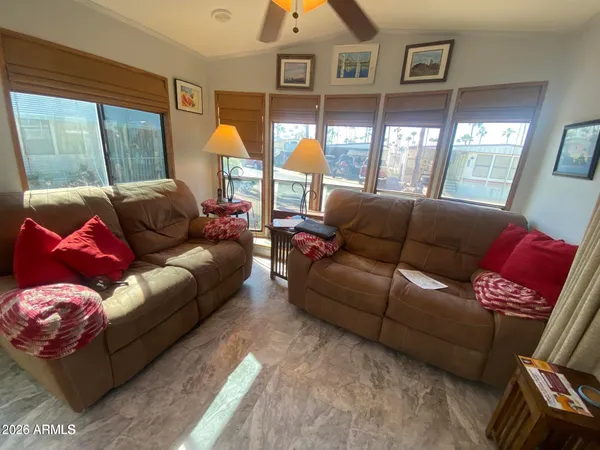 a living room with furniture and a large window