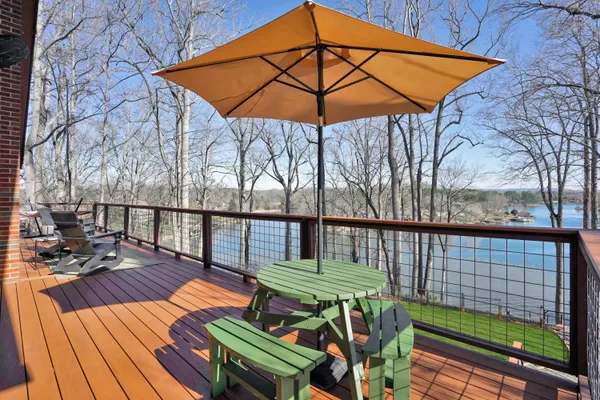 a view of a chairs and table on the deck