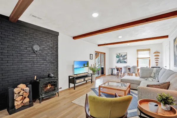 a living room with furniture and a potted plant