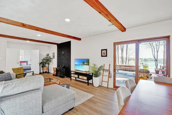 a living room with furniture and large windows