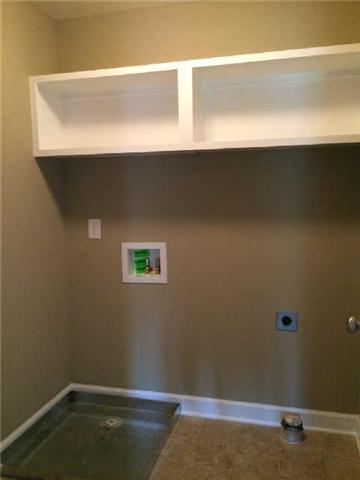 1009 Rudder Drive Spring Hill, TN 37174 - Photo 15 of 17 Laundry Room with Built-In Shelving
