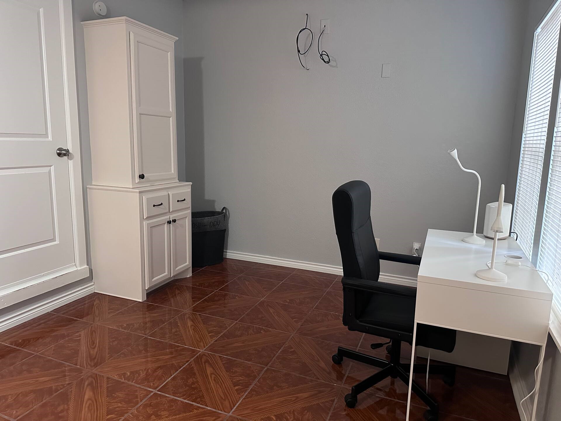 15 Stiles Street Houston, TX 77011 - Photo 12 of 33 a view of a workspace with furniture and wooden floor