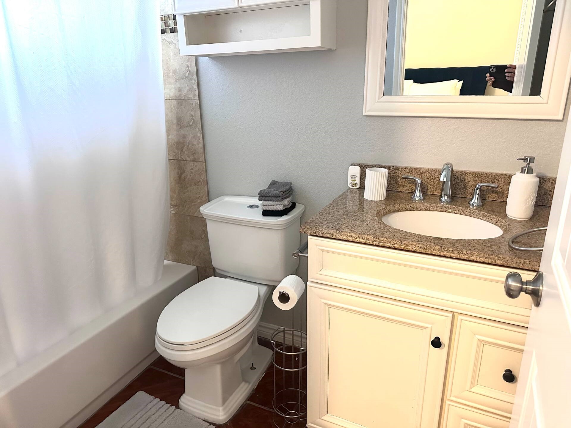 15 Stiles Street Houston, TX 77011 - Photo 15 of 33 a bathroom with a granite countertop toilet sink and mirror