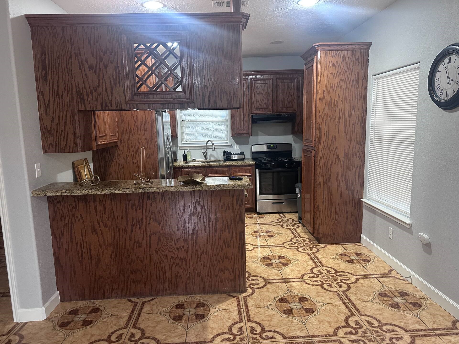 15 Stiles Street Houston, TX 77011 - Photo 22 of 33 a kitchen with stainless steel appliances granite countertop a refrigerator and a stove