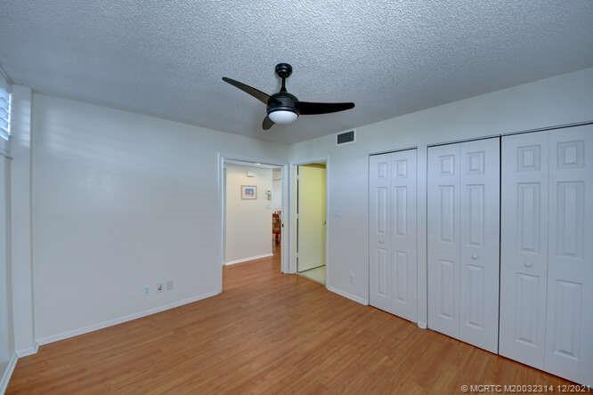 1950 Southwest Palm City Road, Unit 13303 Stuart, FL 34994 - Photo 20 of 34 Guest bedroom with ensuite bathroom.