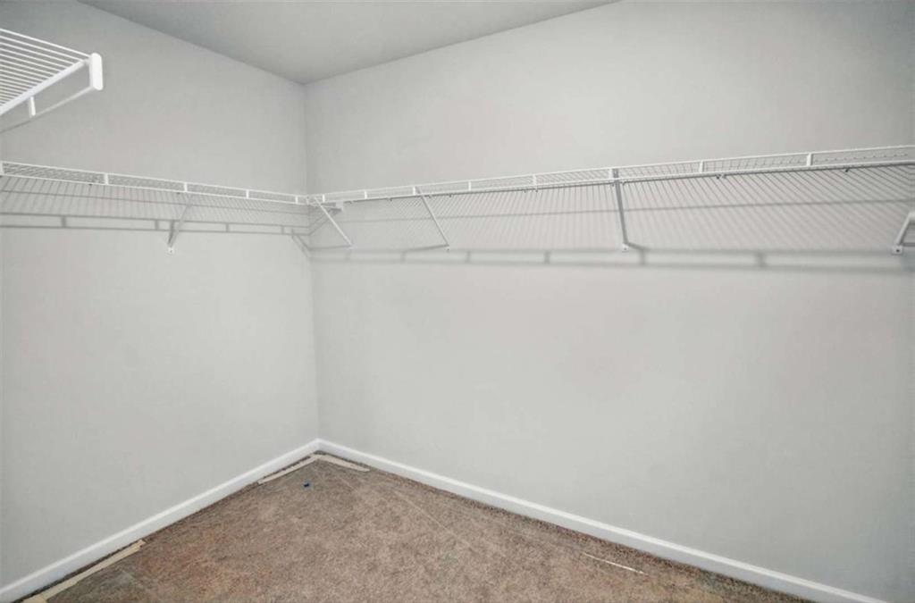 670 River Run Drive Dallas, GA 30132 - Photo 38 of 53 a view of a room with racks on the wall