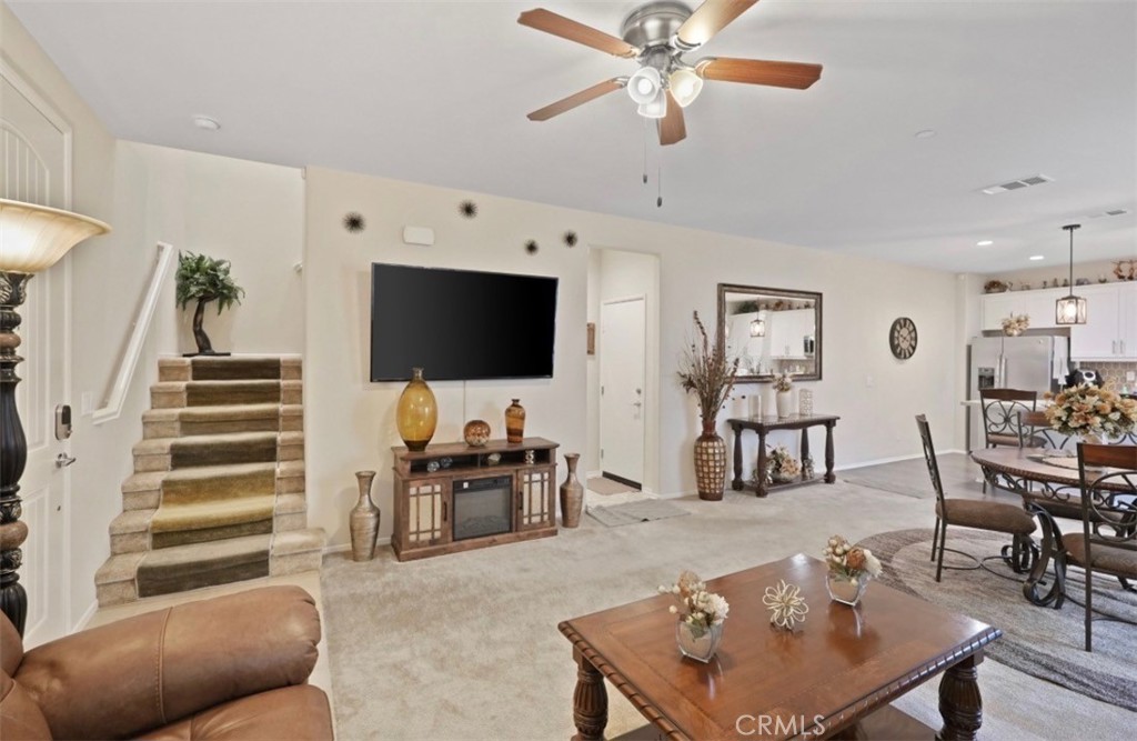 2248 Ridge Court Perris, CA 92571 - Photo 19 of 48 a living room with furniture and a flat screen tv