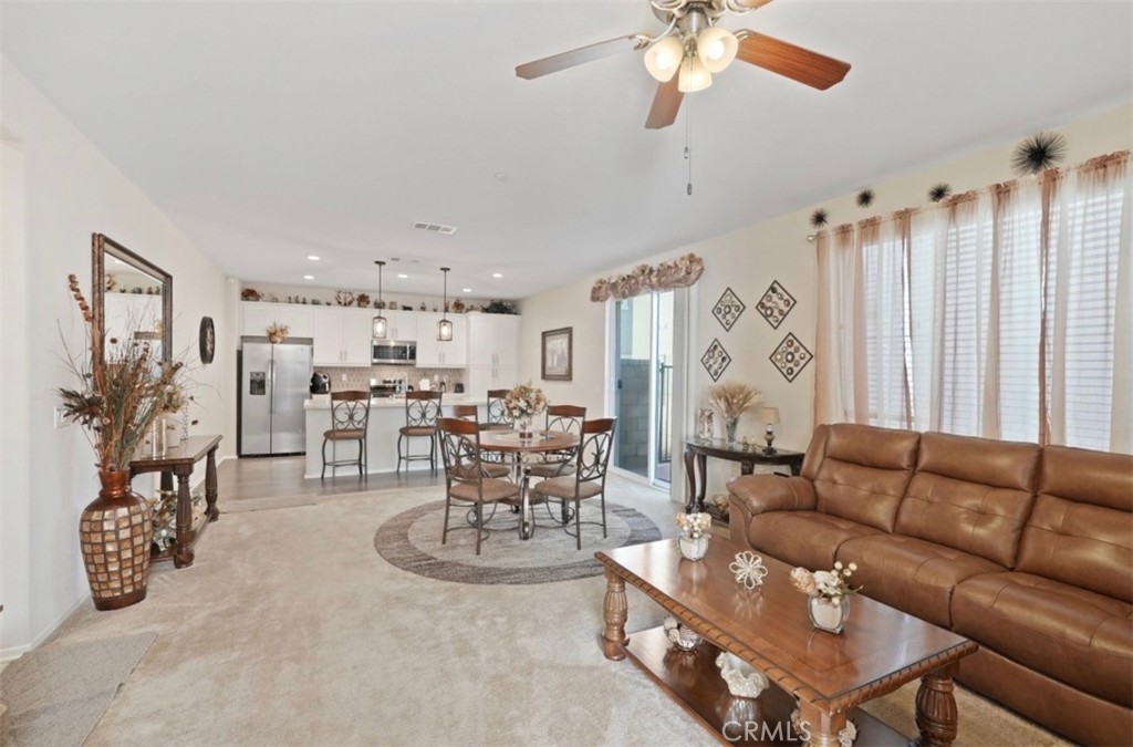 2248 Ridge Court Perris, CA 92571 - Photo 20 of 48 a living room with furniture and a chandelier