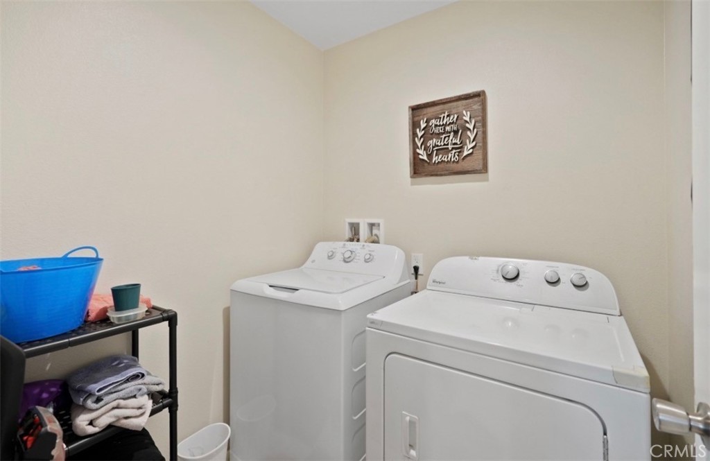2248 Ridge Court Perris, CA 92571 - Photo 21 of 48 a utility room with dryer and washer