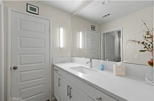 a close view of walk in closet with rug