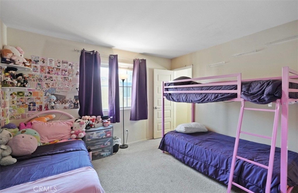 2248 Ridge Court Perris, CA 92571 - Photo 29 of 48 a bedroom with a bed and a window