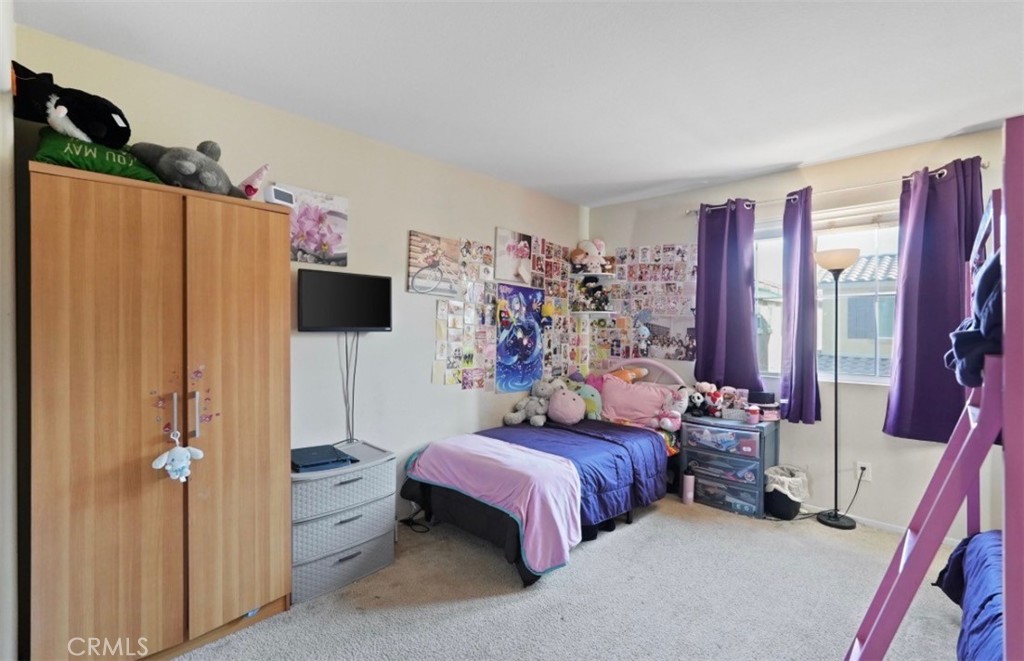 2248 Ridge Court Perris, CA 92571 - Photo 31 of 48 a bedroom with bed and a window