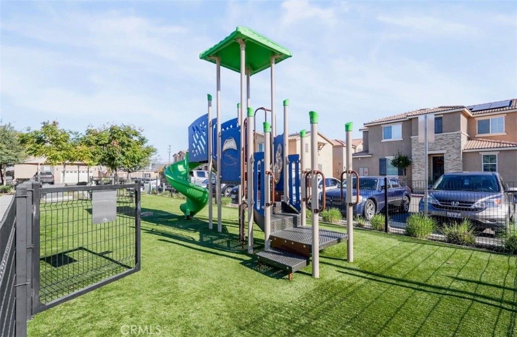 2248 Ridge Court Perris, CA 92571 - Photo 34 of 48 a childrens park with lots of swings and slides
