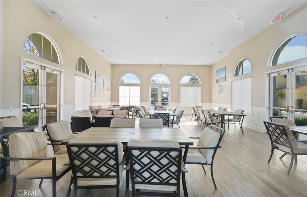 2248 Ridge Court Perris, CA 92571 - Photo 35 of 48 a view of a dining room with furniture window and wooden floor