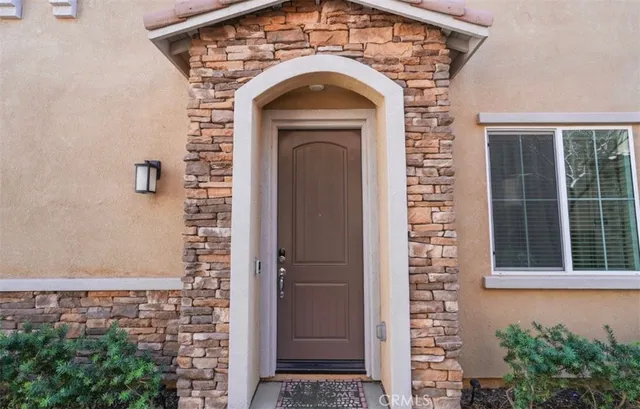 a balcony with table and chairs