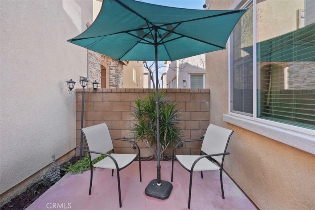 2248 Ridge Court Perris, CA 92571 - Photo 42 of 48 a view of table and chair under an umbrella