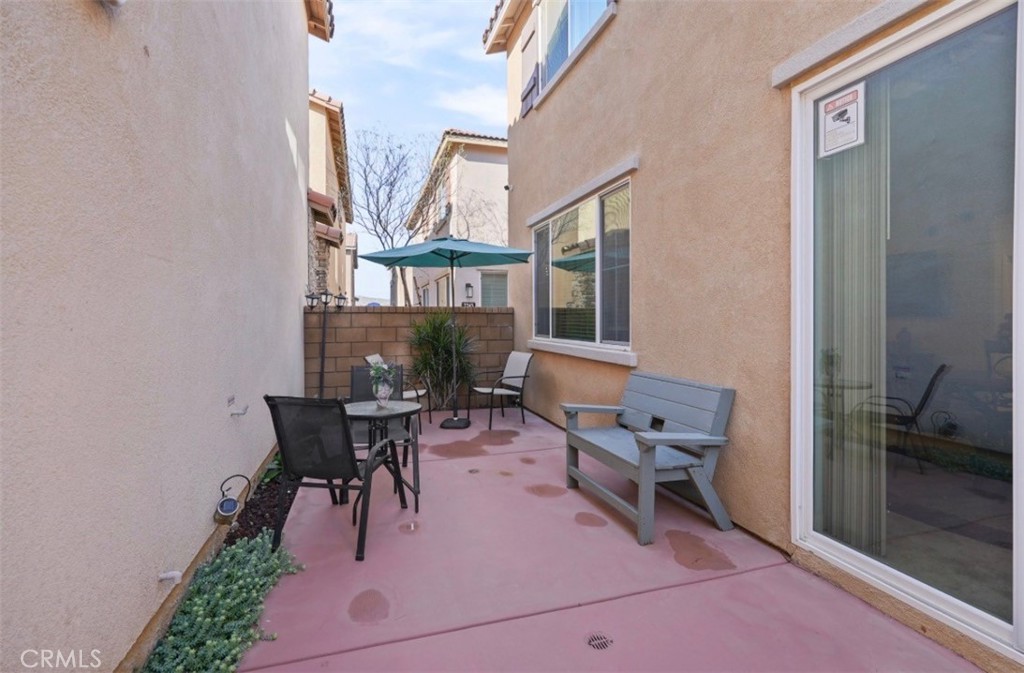 2248 Ridge Court Perris, CA 92571 - Photo 43 of 48 a view of a patio with a dining table and chairs
