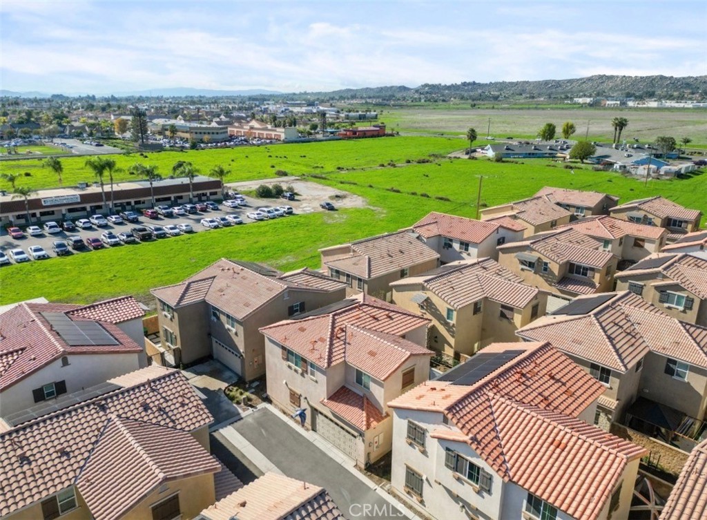 2248 Ridge Court Perris, CA 92571 - Photo 46 of 48 an aerial view of a house with a garden and lake view