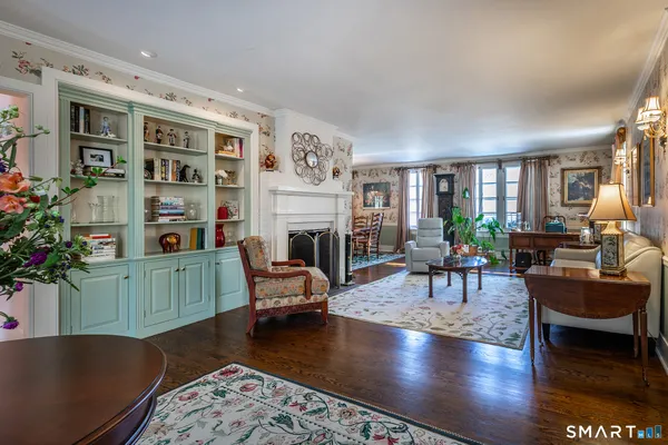 a living room with furniture and a fireplace