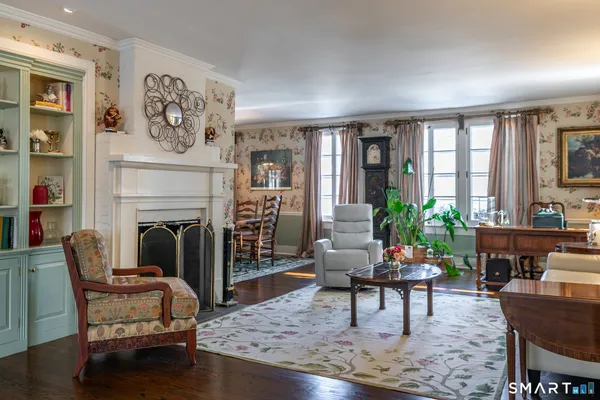 a living room with furniture and a fireplace