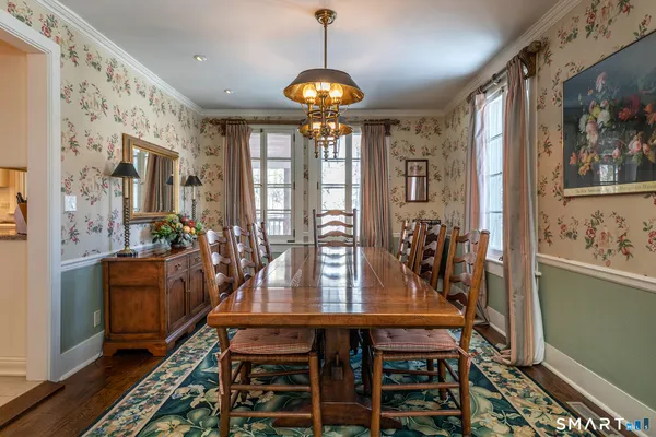 a very nice looking room with furniture and a chandelier