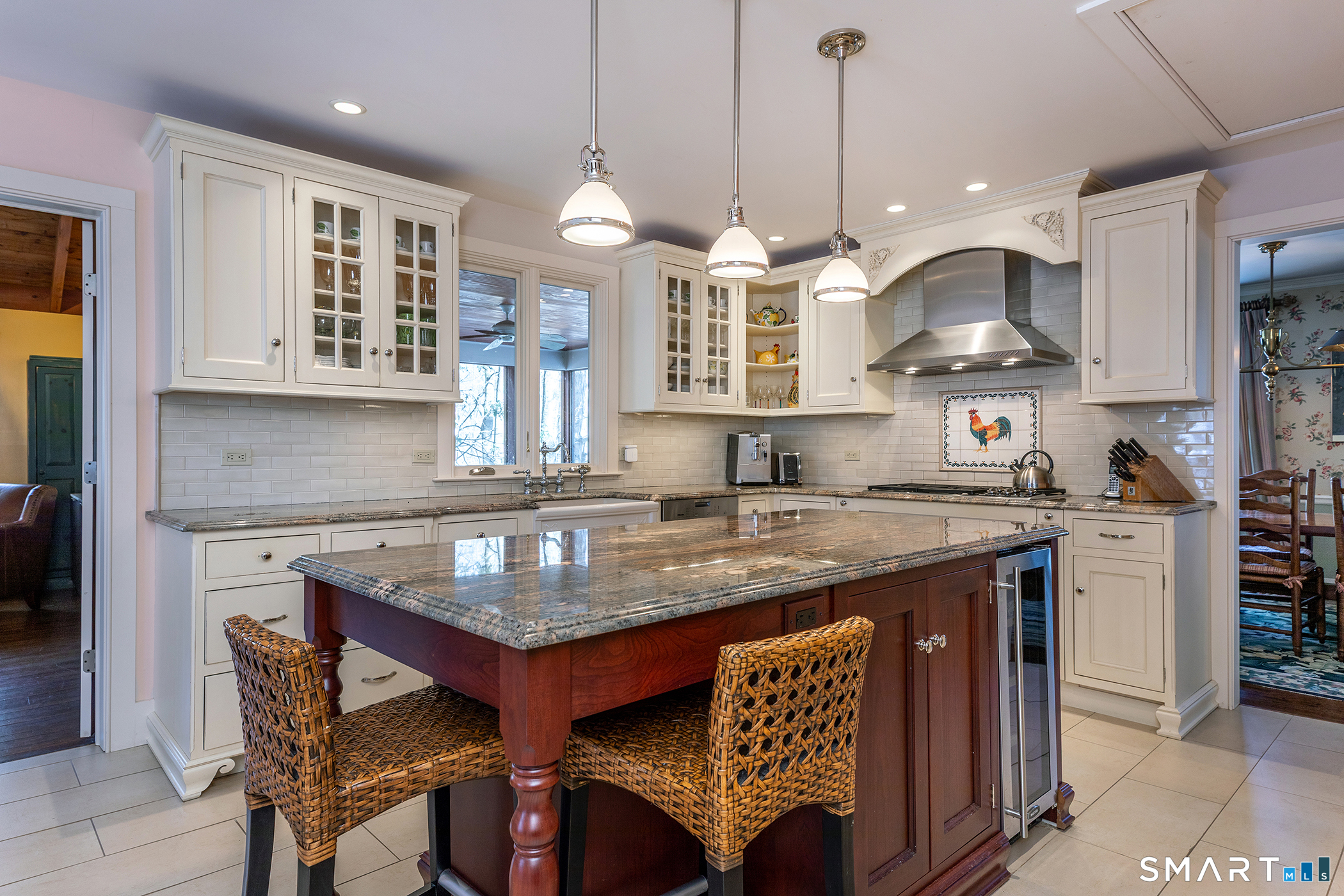 46 Spooner Hill Road Kent, CT 06757 - Photo 19 of 44 a kitchen with stainless steel appliances granite countertop a stove a kitchen island a dining table and chairs