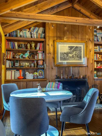 a view of a dining room with furniture and rug