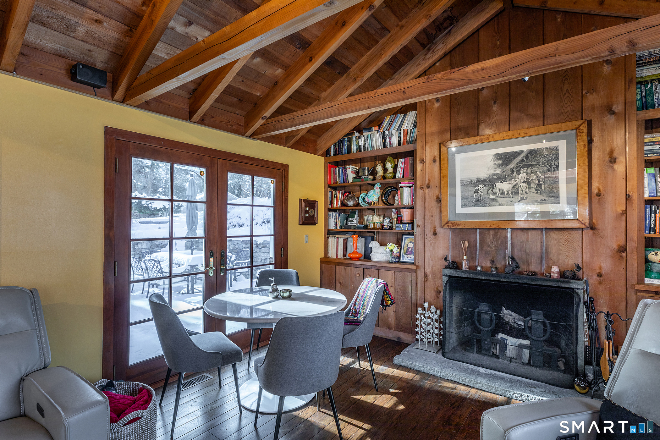 46 Spooner Hill Road Kent, CT 06757 - Photo 26 of 44 a dining room with furniture a fireplace and wooden floor
