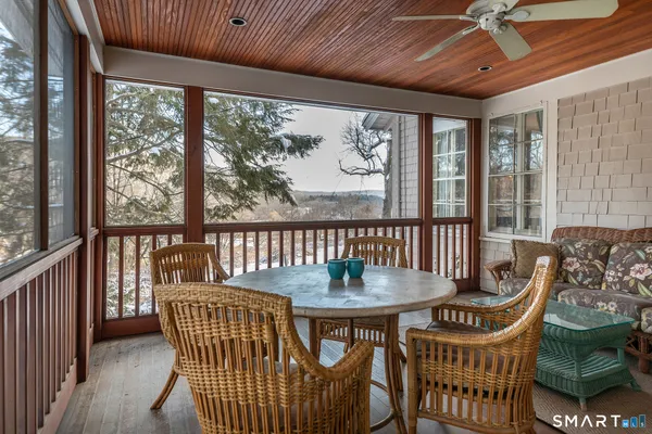 a view of a dining room with furniture window and outside view
