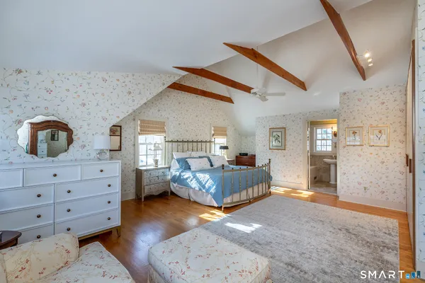 a bed room with a bed and a dresser