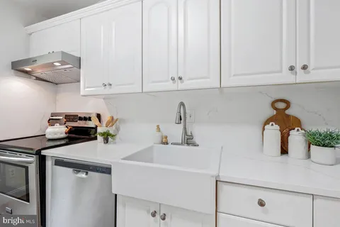 a kitchen with a sink and cabinets