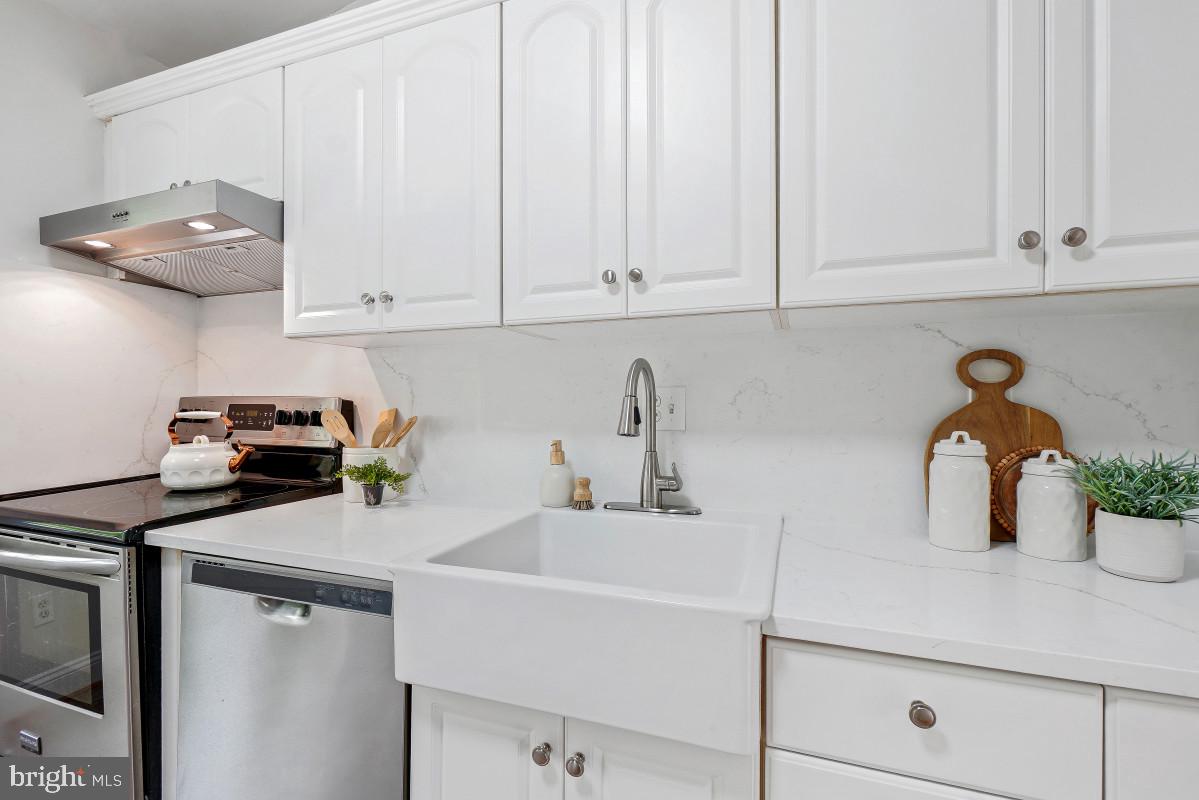 827 Caddington Avenue Silver Spring, MD 20901 - Photo 16 of 45 a kitchen with a sink and cabinets