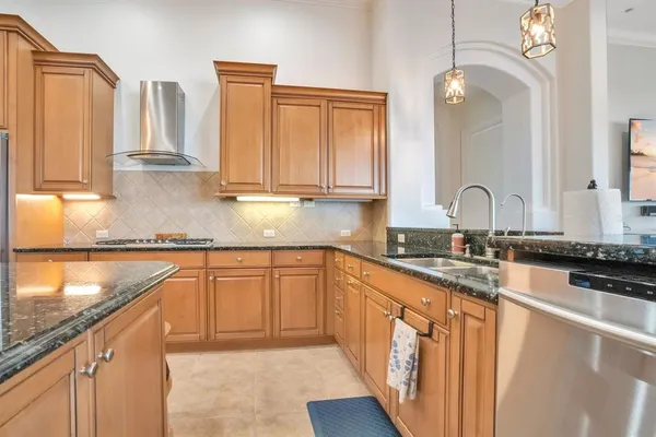 a spacious bathroom with a mirror sink and vanity