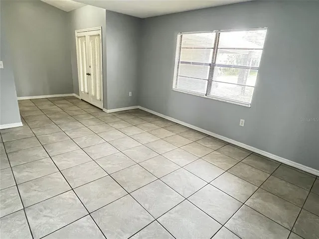 a view of an empty room and window