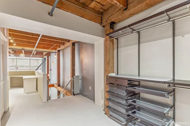a view of an empty room with a fireplace