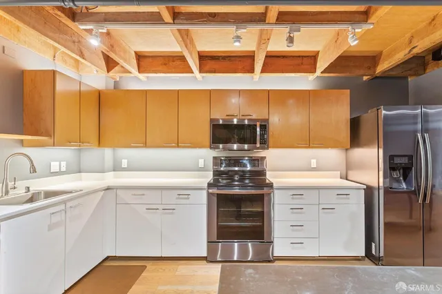 a kitchen with a sink and cabinets