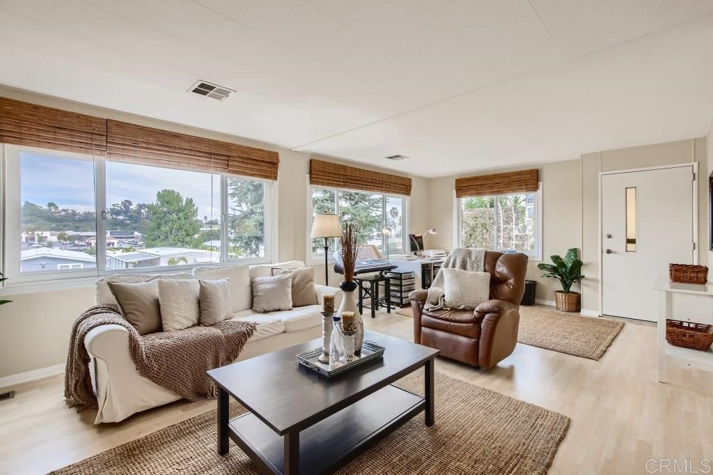 444 North El Camino Real, Unit SPC 57 Encinitas, CA 92024 - Photo 1 of 28 a living room with furniture and a large window